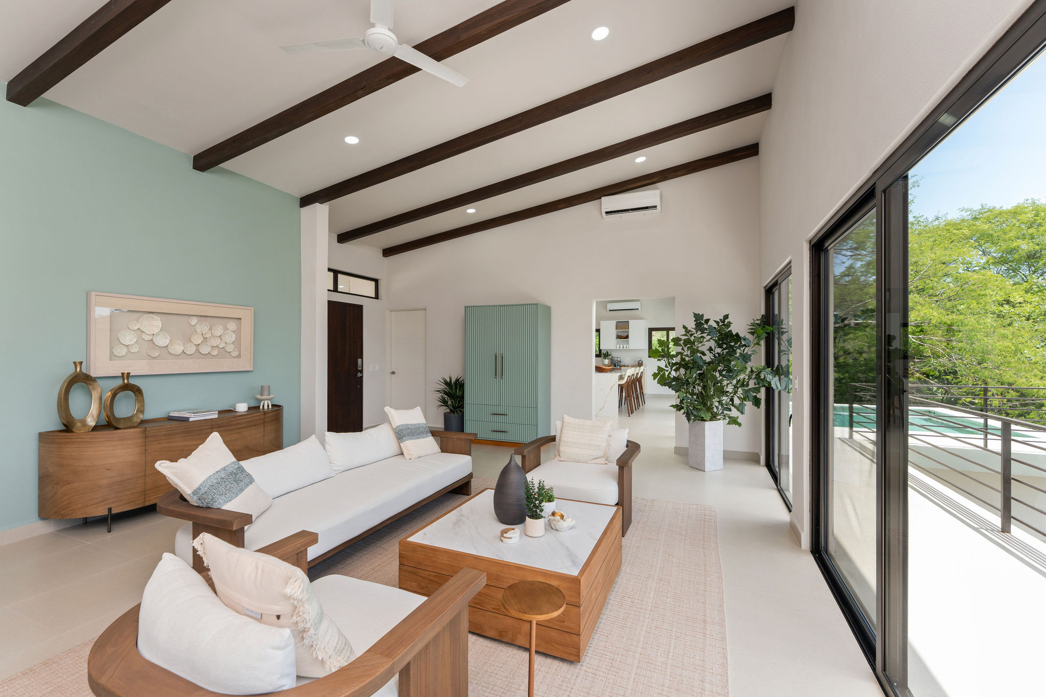 Family room with comfortable seating and large windows