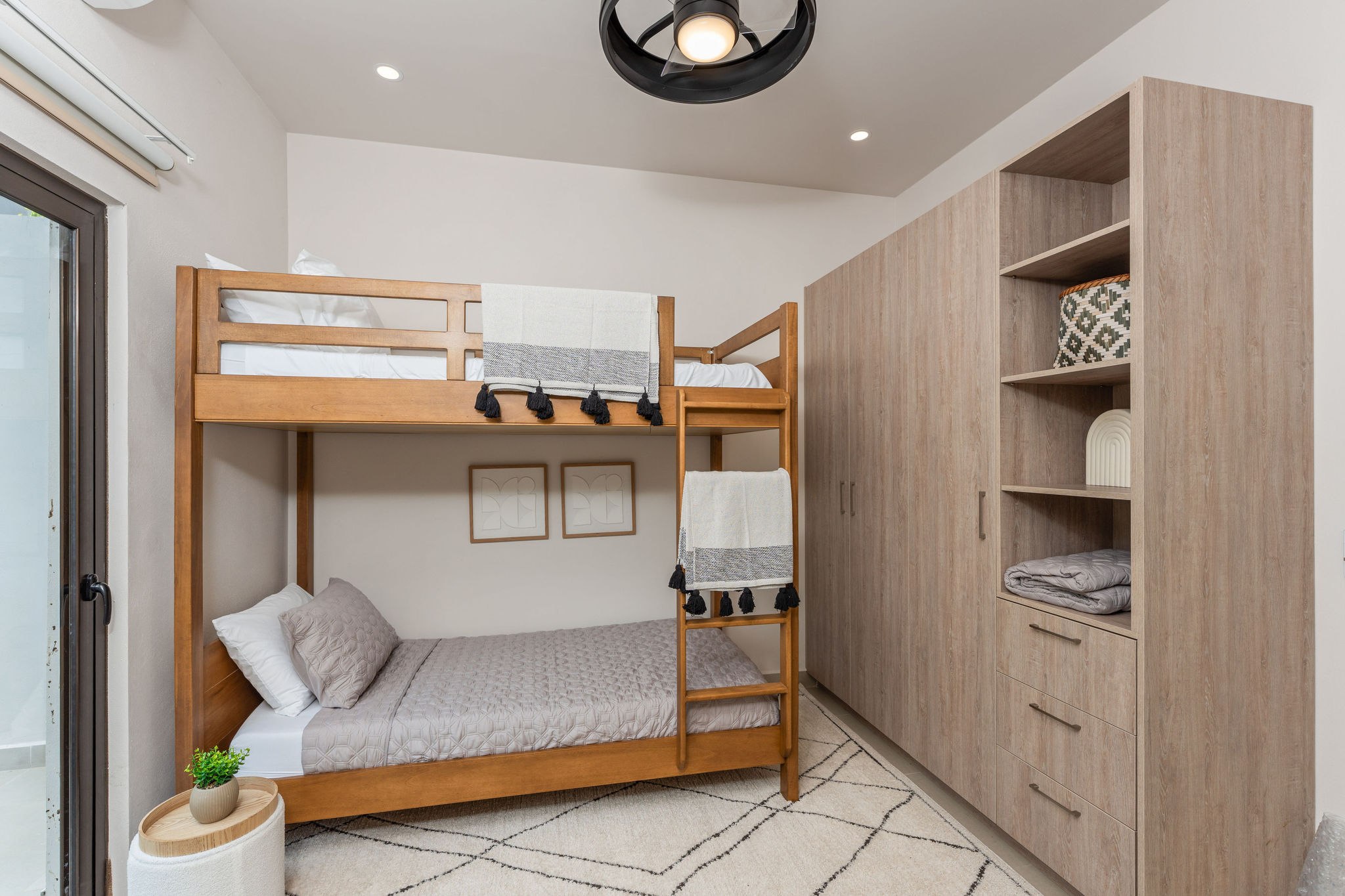 Bunk room with a full-size lower bed and upper bunk
