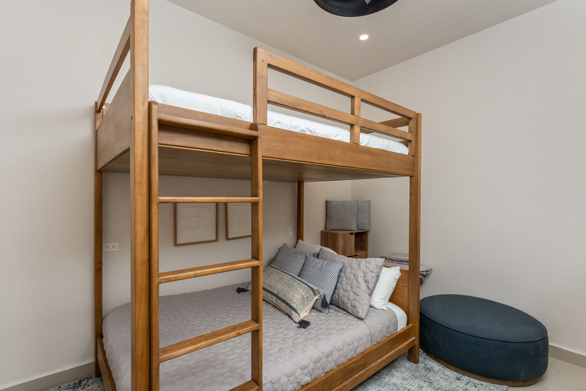 Bunk room with full-size lower bed and upper bunk