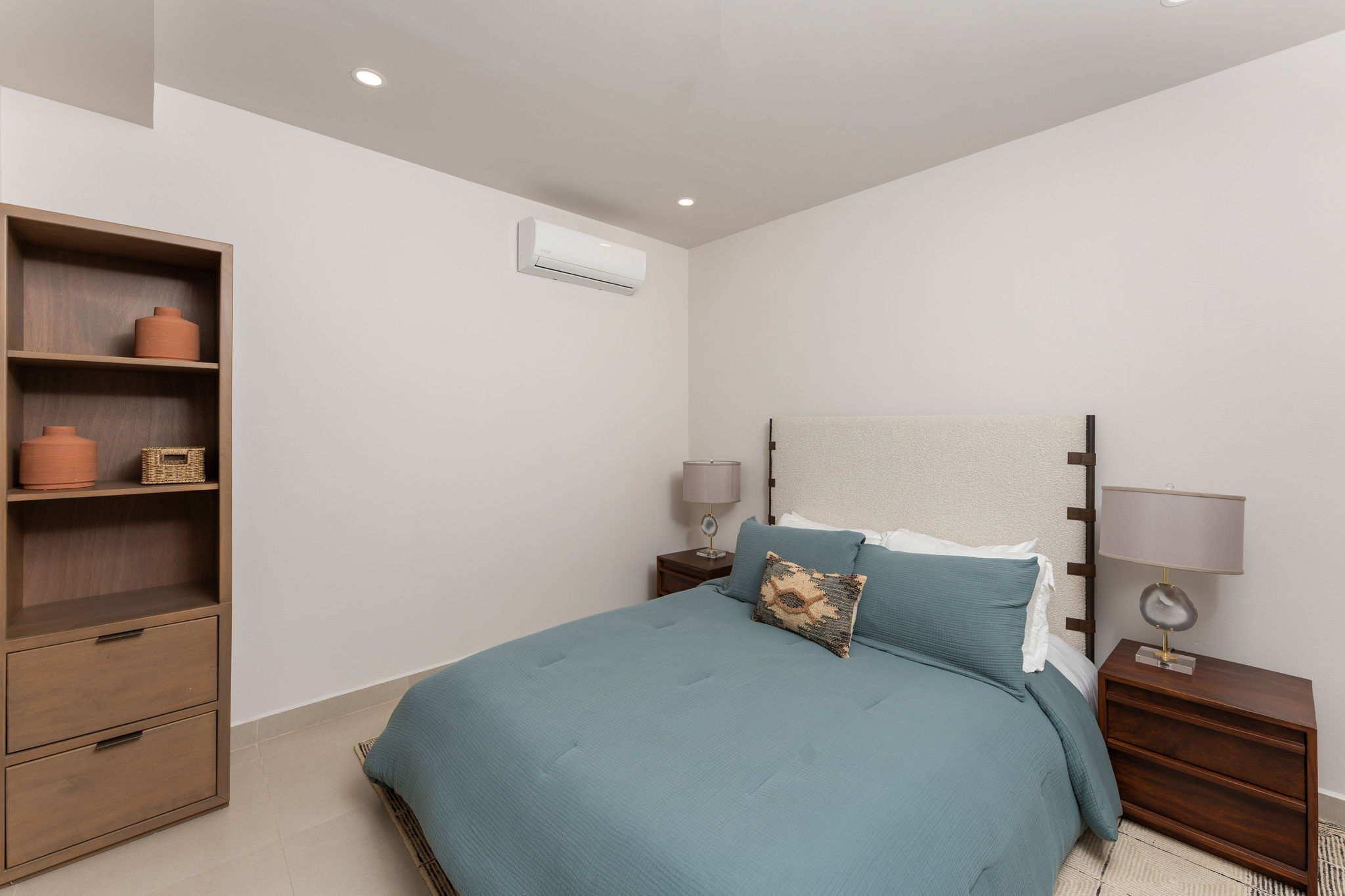 Bedroom with a queen bed and bedside tables