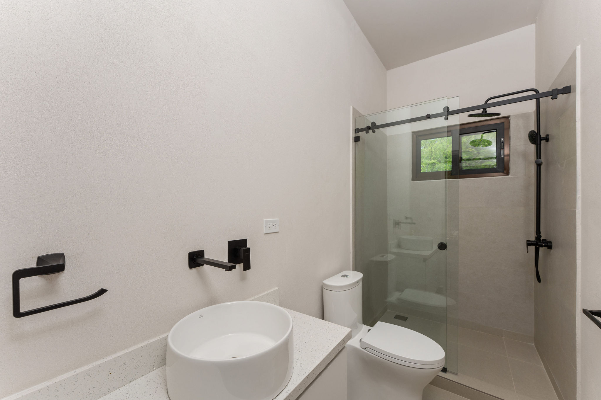 Bathroom with a glass-enclosed walk-in shower