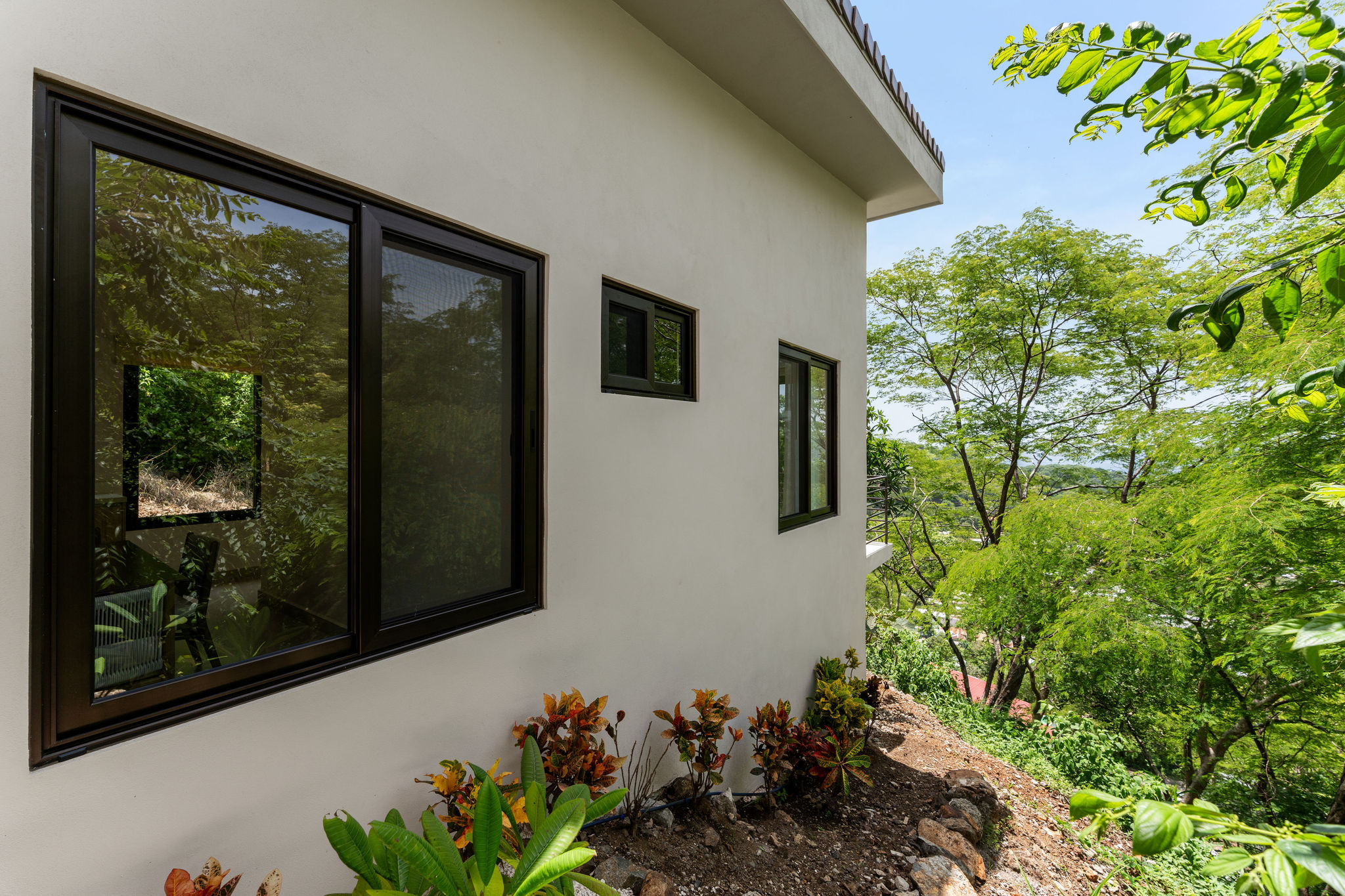 Casa Cielo exterior surrounded by tropical greenery